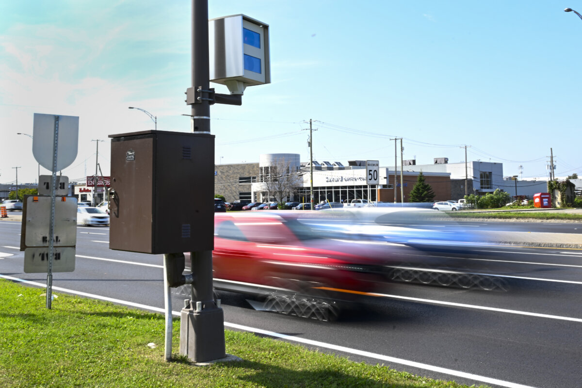 Cars drive by a photo radar in Quebec City in a file photo. (The Canadian Press/Jacques Boissinot)