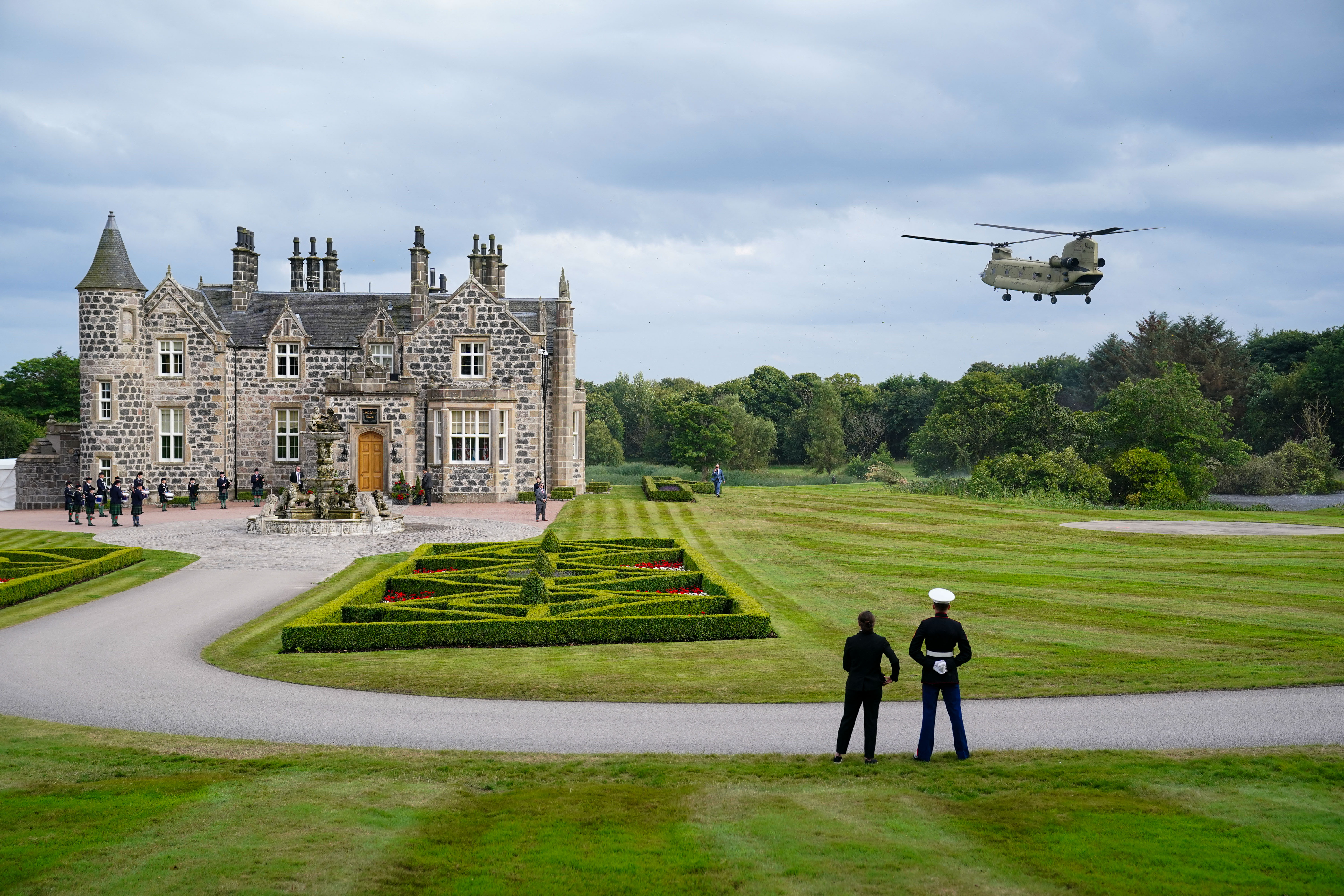 Day in Photos: Trump Visits Scotland, Train Accident in Germany, Protests in Indonesia
