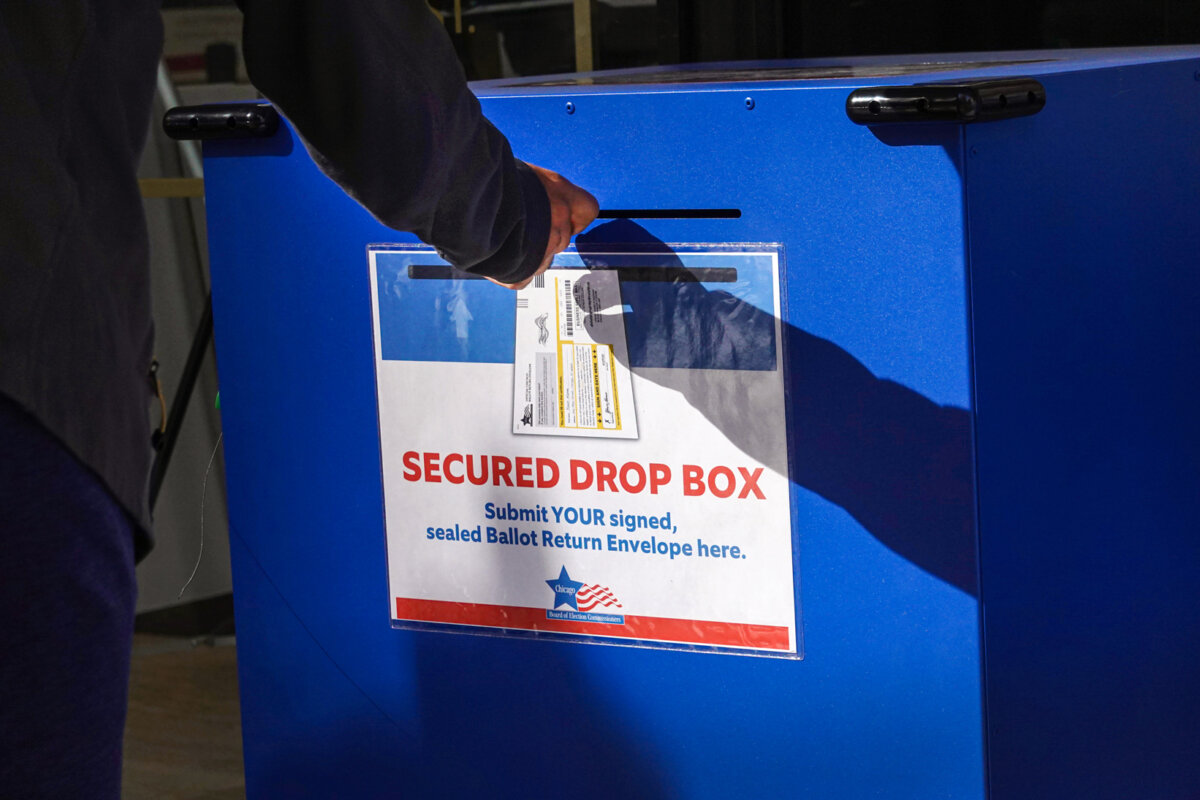 A resident drops off a vote-by-mail ballot in a drop box in Chicago on Oct. 2, 2020. (Scott Olson/Getty Images)