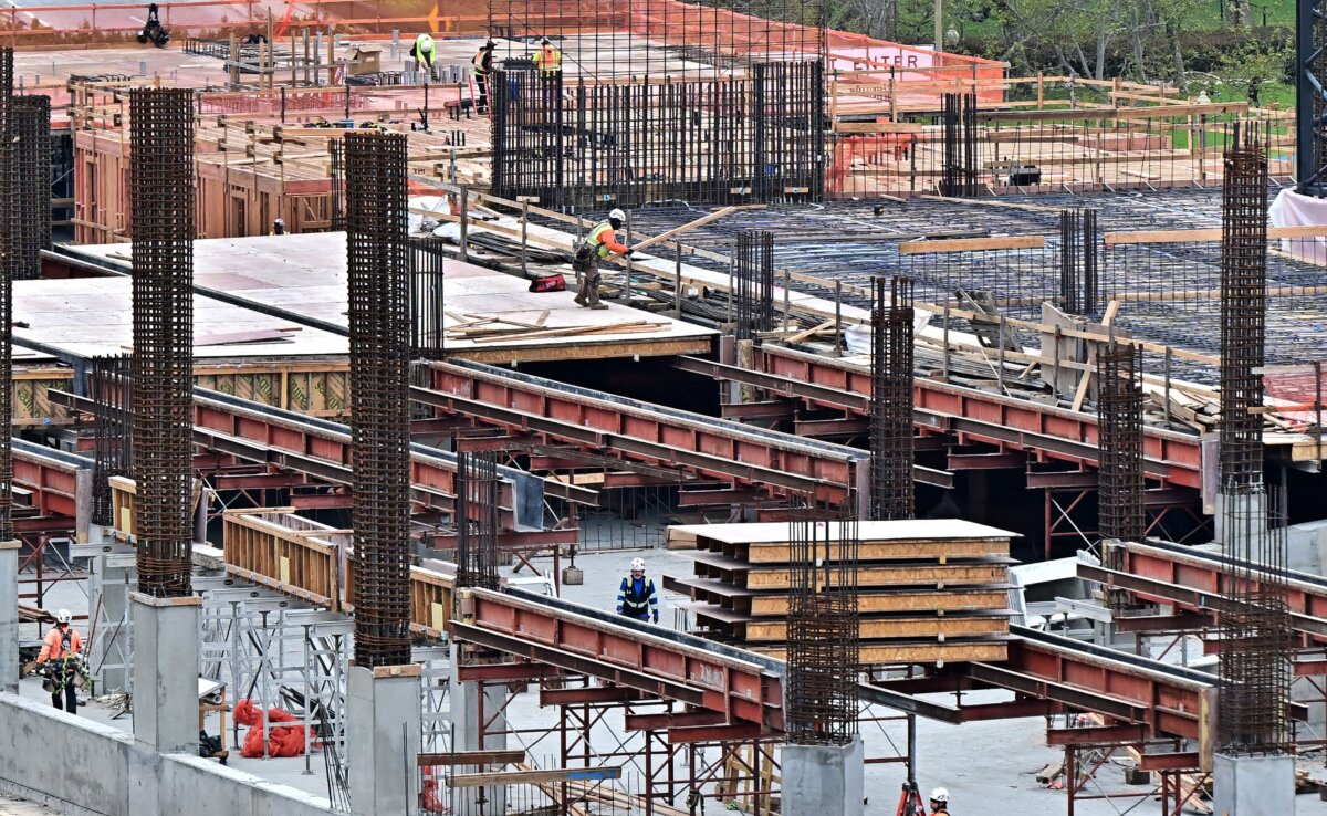 Construction workers are seen on the site of a new development in Long Beach, Calif., on March 5, 2025. (Frederic J. Brown/AFP via Getty Images)