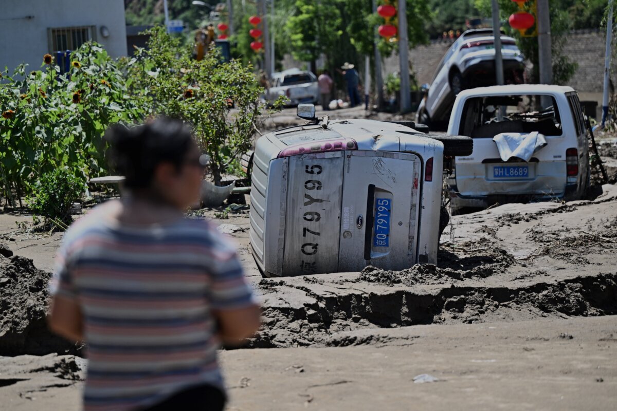 Flood-damaged cars are seen following heavy rains over the past few days in Huairou district, on the outskirts of Beijing on July 30, 2025. (Pedro Pardo/AFP via Getty Images)