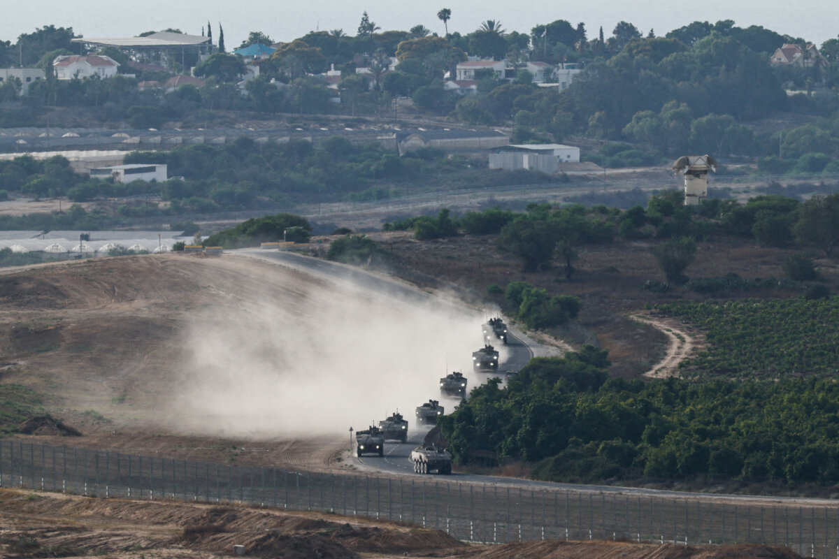 An Israeli military convoy maneuvers near the Israel-Gaza border, as seen from Israel, July 1, 2025. (Amir Cohen/Reuters)