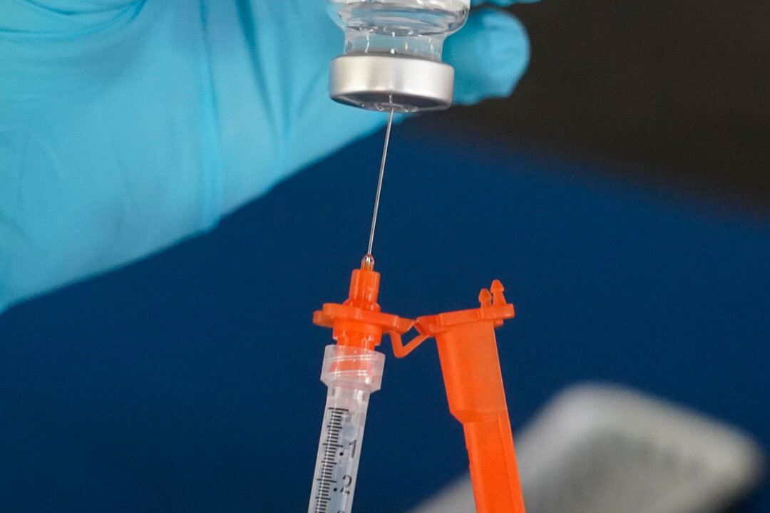 A nurse loads a syringe with a COVID-19 vaccine in Jackson, Miss., on Nov. 18, 2022. (Rogelio V. Solis/AP Photo)