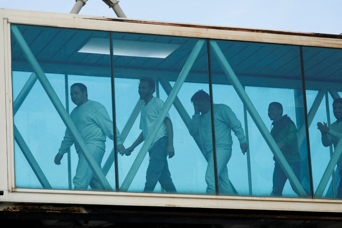 Venezuelan migrants react after arriving on a deportation flight from the United States at Simon Bolivar International Airport, in Maiquetia, Venezuela, on May 9, 2025. (Leonardo Fernandez Viloria/Reuters)