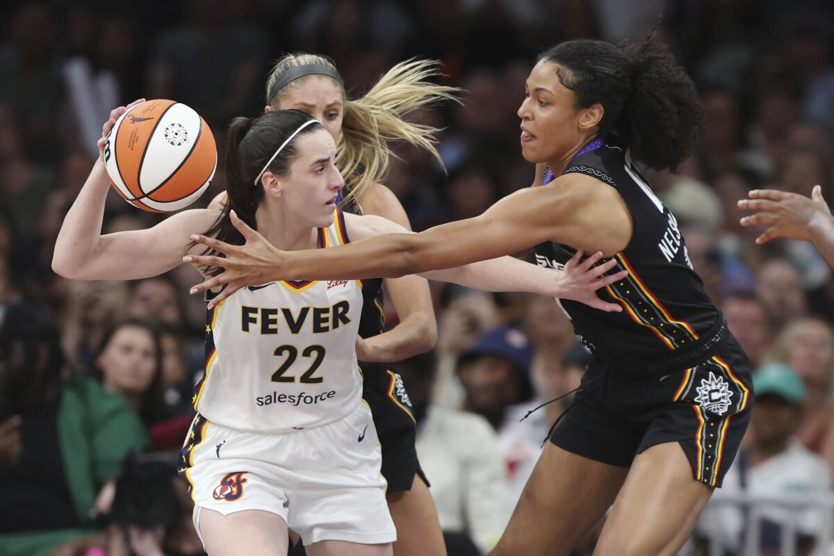 Connecticut Sun's Olivia Nelson-Ododa, right, defends against Indiana Fever's Caitlin Clark (22) during the second half of a WNBA basketball game in Boston on July 15, 2025. (Michael Dwyer/AP Photo)