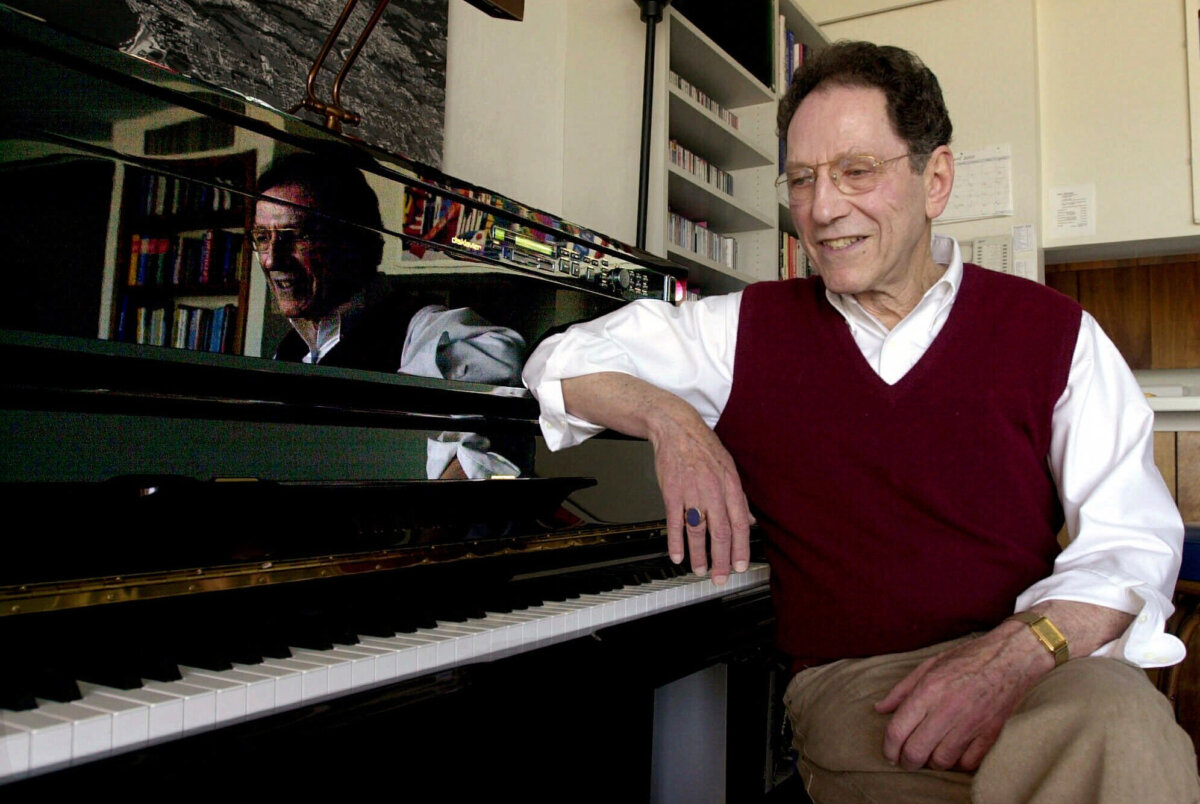 Musician Tom Lehrer sits beside the piano in his house in Santa Cruz, Calif., on April 21, 2000. (AP Photo/Paul Sakuma, File)