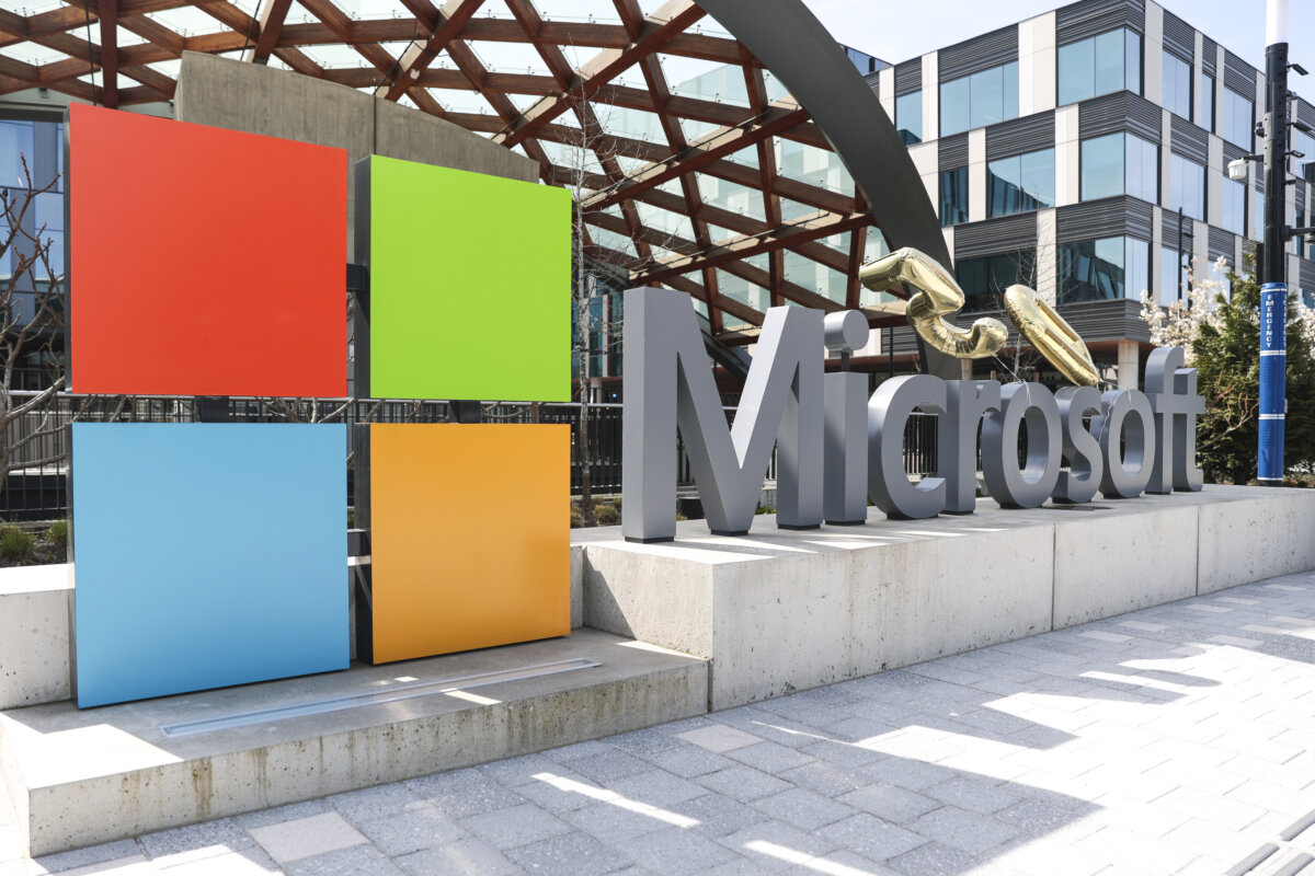 A Microsoft sign and logo are pictured at the company's headquarters in Redmond, Wash., on April 4, 2025. (Jason Redmond/AP Photo)