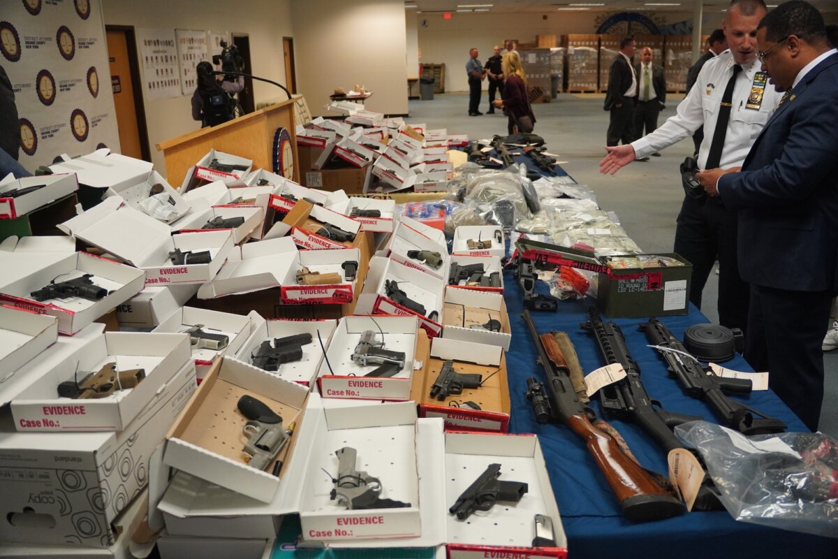 Confiscated guns and narcotics on display at a news conference regarding Operation Powder Burn, in Goshen, N.Y., on Aug. 1, 2025. (Oliver Mantyk/The Epoch Times)