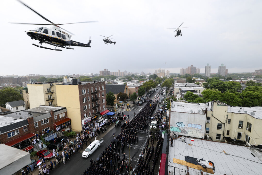 America in Photos: The Funeral of Didarul Islam, Tesla Diner Opening, and Indiana State Fair