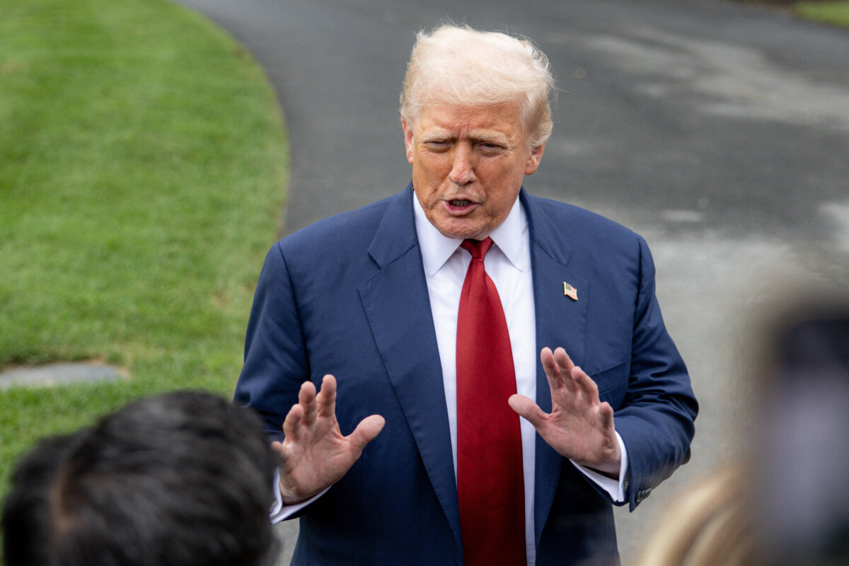 President Donald Trump speaks to the media before boarding Marine One on the South Lawn of the White House in Washington on Aug. 1, 2025. (MEHMET ESER/Middle East Images/AFP via Getty Images)