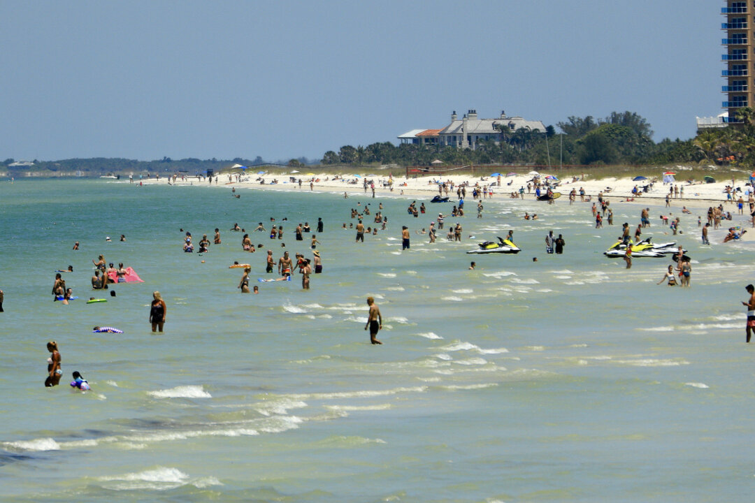 People on the beach in Florida, in this file photo. (Mike Ehrmann/Getty Images)