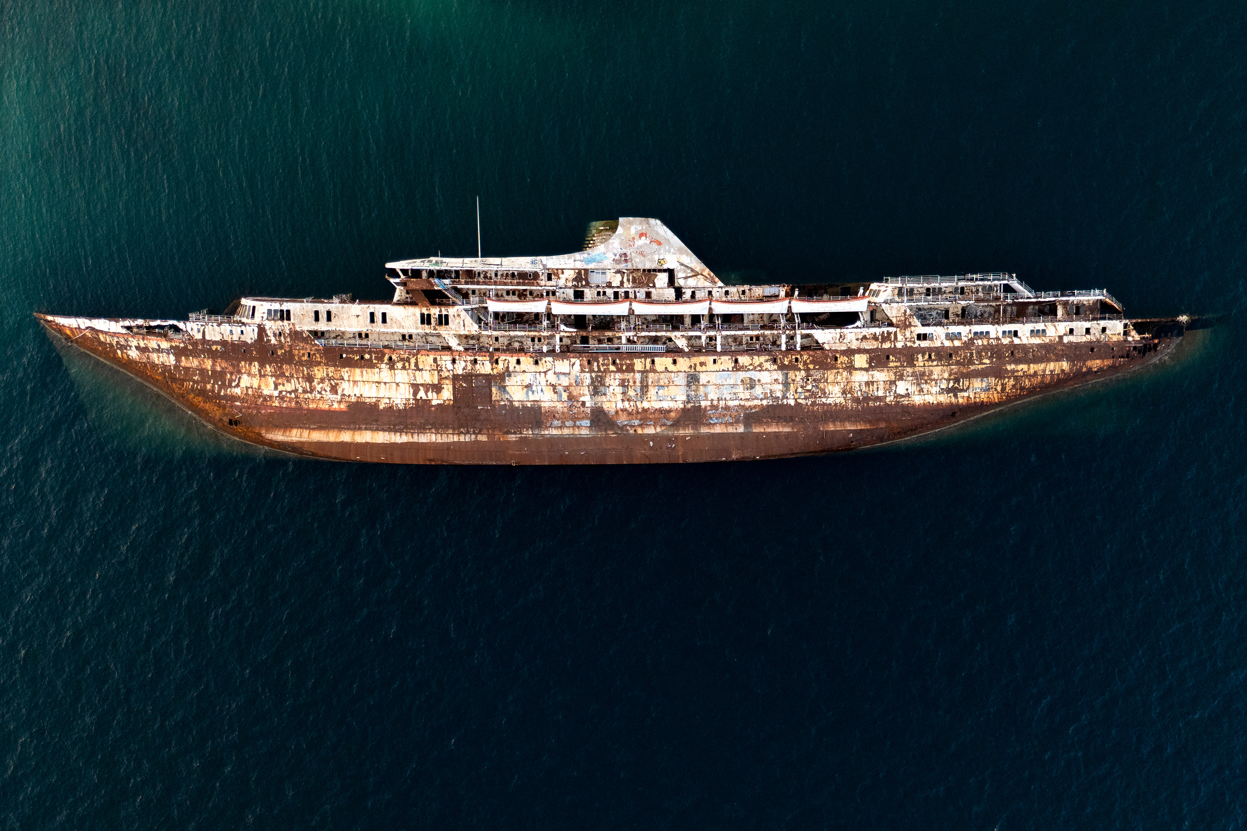 Day in Photos: Abandoned Cruise Ship, Beirut Explosion Anniversary, Storm Floris Threatens UK
