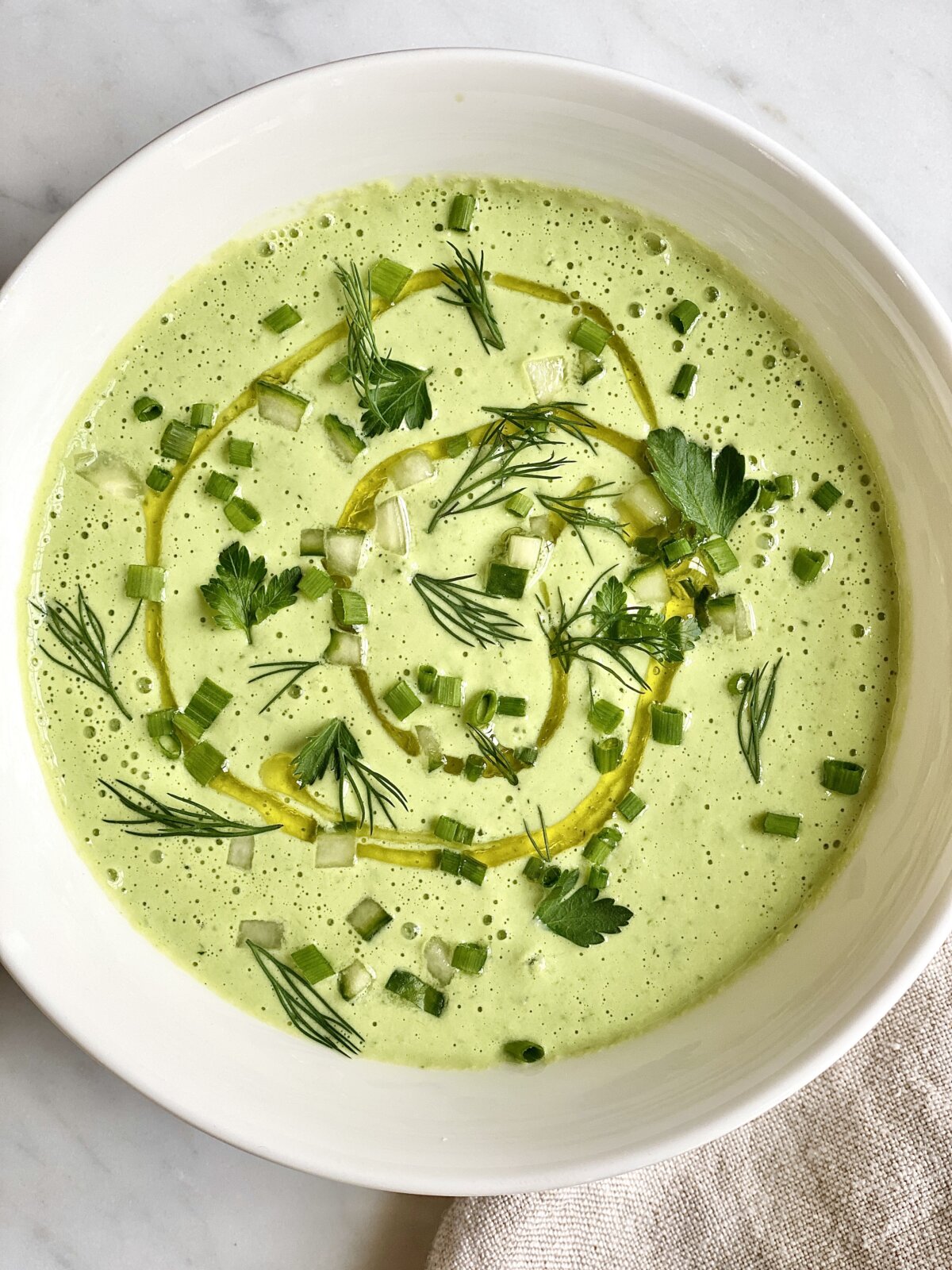 With yogurt and herbs, this chilled cucumber soup is the most delicious way to beat the heat. (Kelli Foster/TCA)