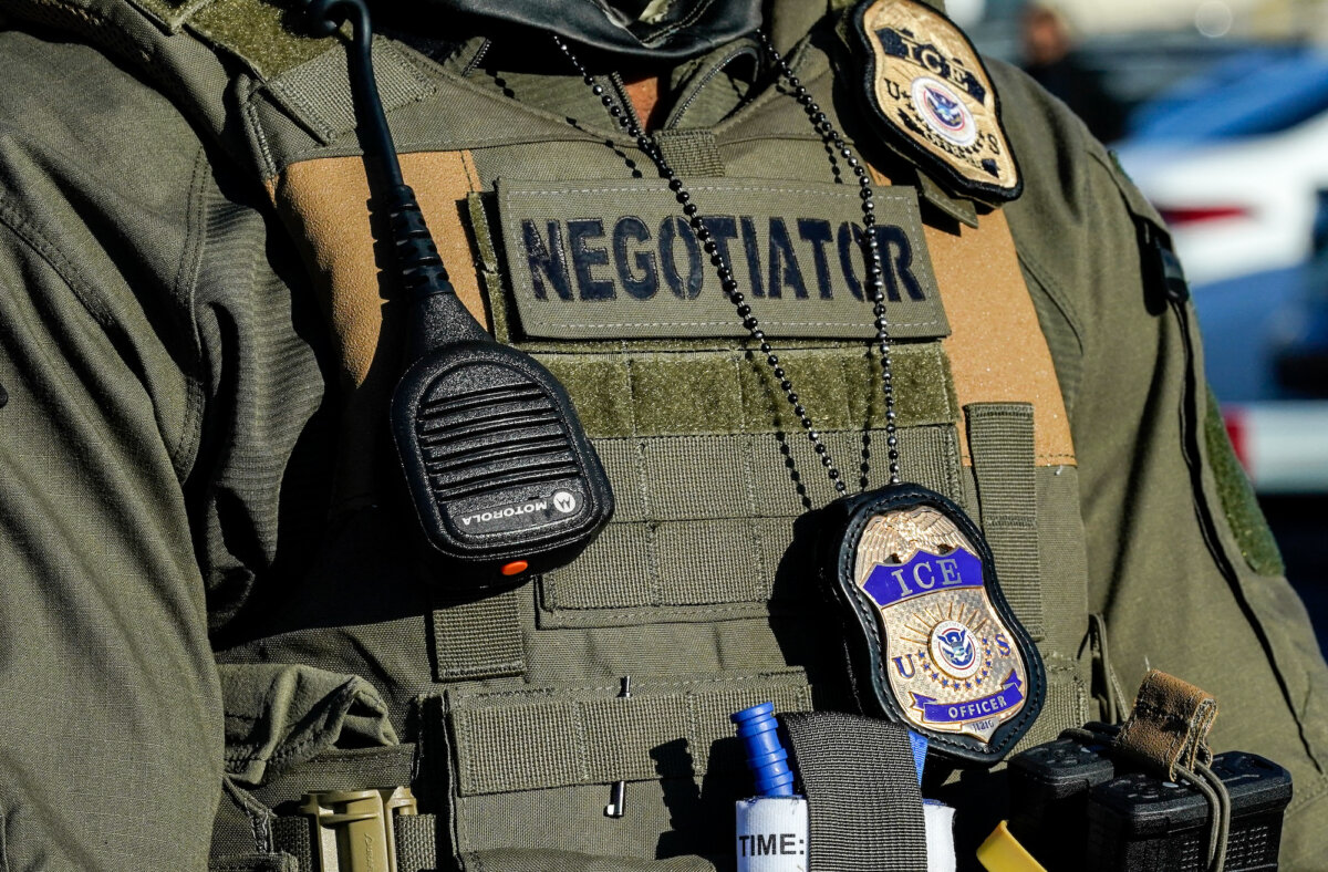 Immigration and Customs Enforcement (ICE) agents stand near a gate at o detention centre in Newark, N.J., on May 7, 2025. (Timothy A. Clary/AFP/Getty Images)