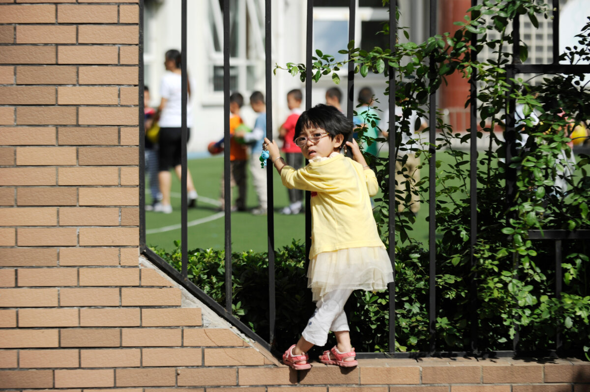 A girl outside a kindergarten in Beijing on Sept. 19, 2012. (Wang Zhao/AFP/GettyImages)