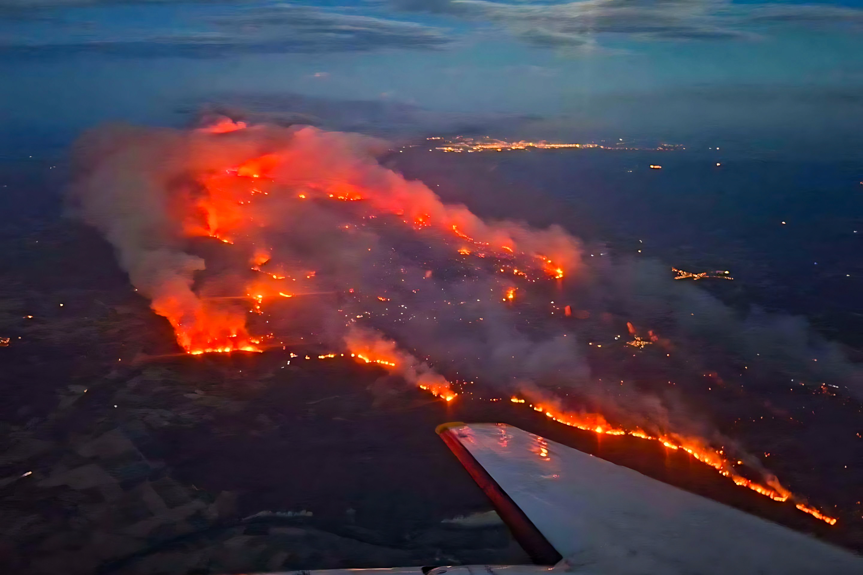 Day in Photos: Massive Fires in France, Ice Production, and Lightsaber Up for Auction