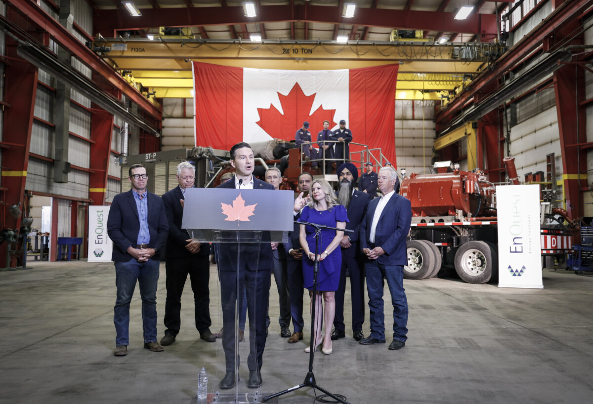 Federal Conservative Leader Pierre Poilievre, centre, speaks at a news conference in Calgary, on Aug. 7, 2025. (THE CANADIAN PRESS/Jeff McIntosh)