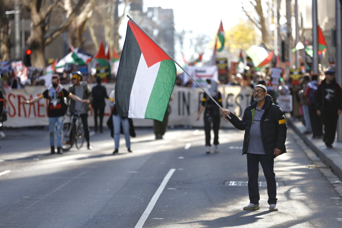 Protesters march along King Street during a Free Palestine rally at the State Library of Victoria in Melbourne, Australia on Aug. 3, 2025. (AAP Image/Con Chronis)