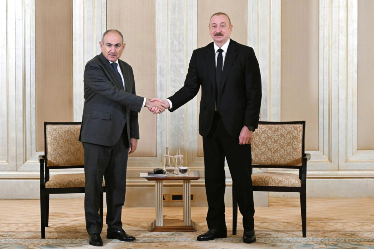 Azerbaijani President Ilham Aliyev (R) and Prime Minister of Armenia Nikol Pashinyan pose for a photo prior to their talks in Abu Dhabi, United Arab Emirates, on July 10, 2025. (Azerbaijani Presidential Press Office via AP)