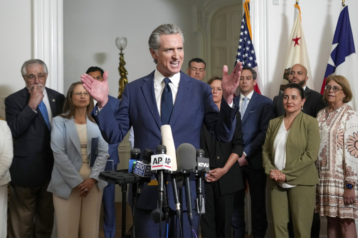 Accompanied by California and Texas lawmakers, California Gov. Gavin Newsom (C) discusses the push to schedule a special election to redraw California's congressional voting districts, during a news conference in Sacramento, Calif., on Aug. 8, 2025. (Rich Pedroncelli/AP Photo)