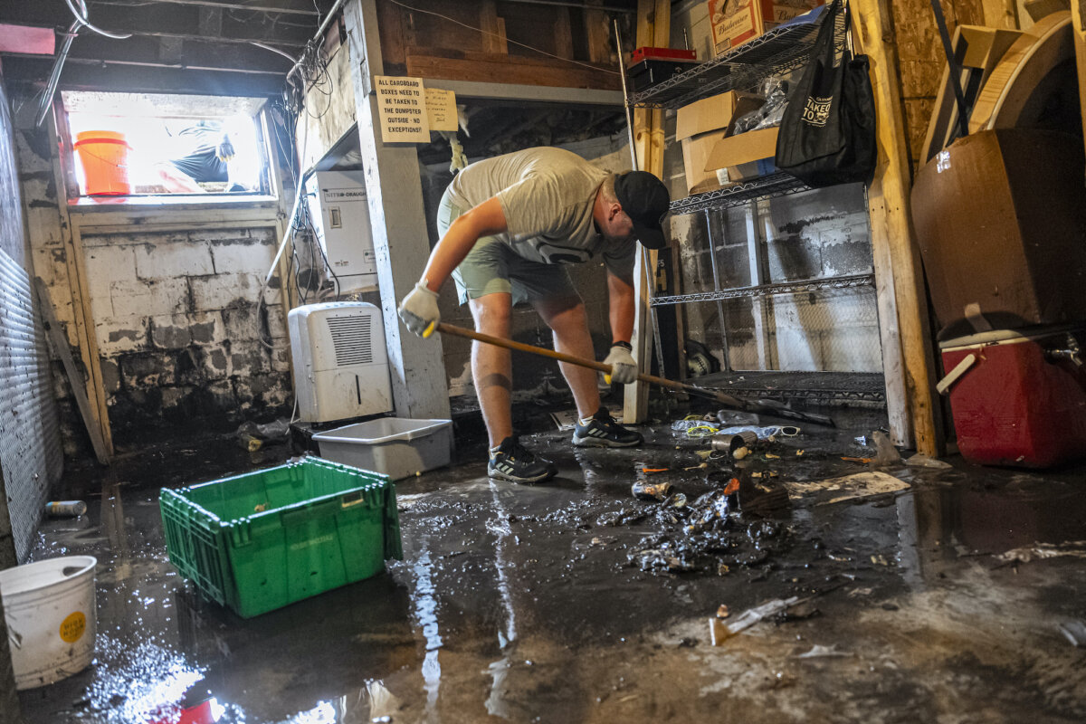 Patrick Carrol helps clean out the basement of Franky's Newport bar, on Aug. 11, 2025, in Milwuakee. (Andy Manis/AP Photo)