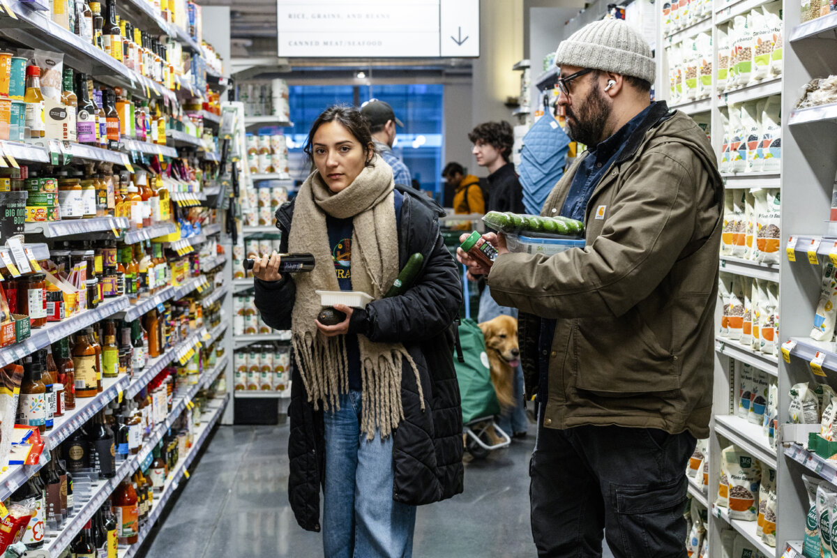 People shop at a grocery store in New York City on March 12, 2025. (Samira Bouaou/The Epoch Times)