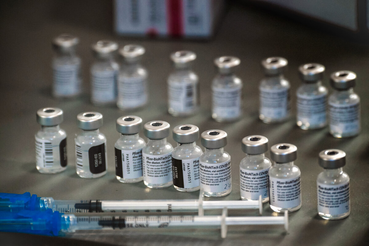 Syringes and vials of the Pfizer-BioNTech COVID-19 vaccine are prepared to be administered to healthcare workers at a drive-up vaccination site in Reno, Nev., on Dec. 17, 2020. (Patrick T. Fallon/AFP via Getty Images)