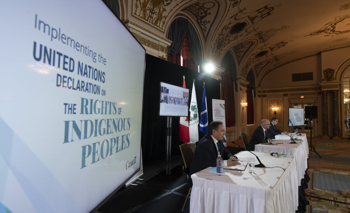 (L–R) Then-Assembly of First Nations Chief Perry Bellegarde, then-Justice Minister David Lametti, and president of the Inuit Tapiriit Kanatami Natan Obed participate in an announcement about the United Nations Declaration on the Rights of Indigenous Peoples, in Ottawa on Dec. 3, 2020. (The Canadian Press/Adrian Wyld)