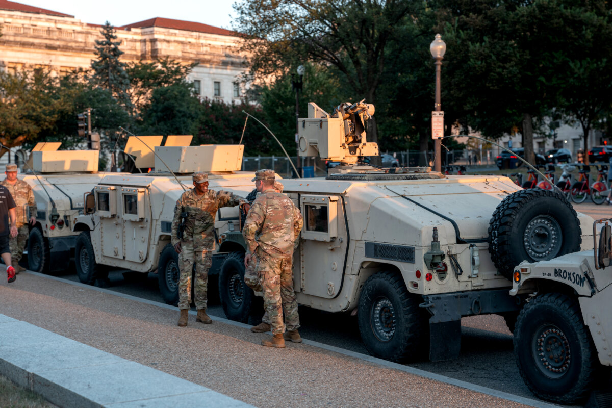National Guard troops gather near the Washington Monument as part of President Trump's mobilization of law enforcement in Washington on Aug. 12, 2025. (Andrew Leyden/Getty Images)