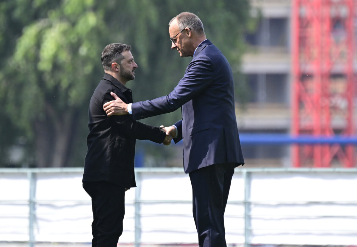 Ukrainian President Volodymyr Zelenskyy, (L), is welcomed by Germany's Chancellor Friedrich Merz upon arrival in Berlin, Germany, on Aug. 13, 2025 (John MacDougall/AP)