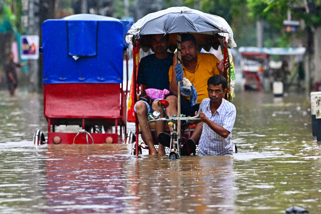 NextImg:Day in Photos: Floods In India, Wildfire in Greece, and Sailing Ship Festival