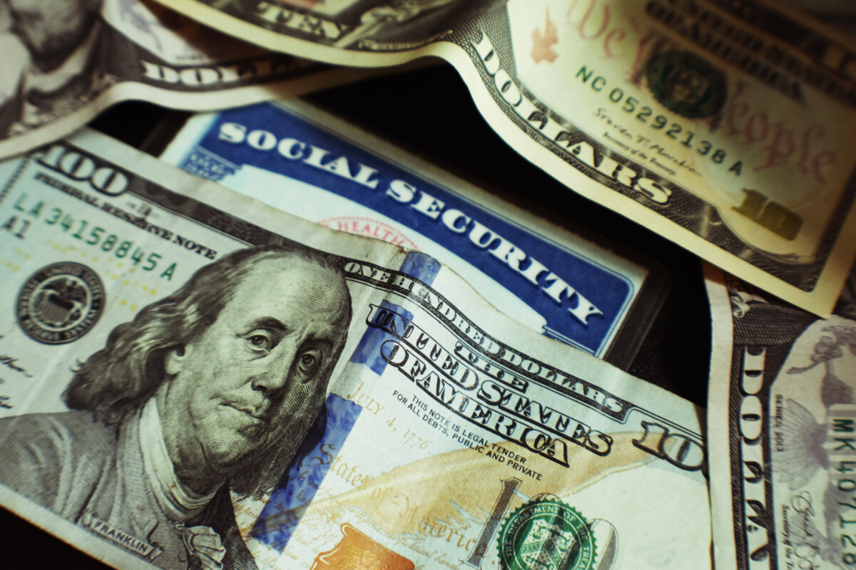 A Social Security card surrounded by U.S. currency, in this file photo. (Dreamstime/TCA)