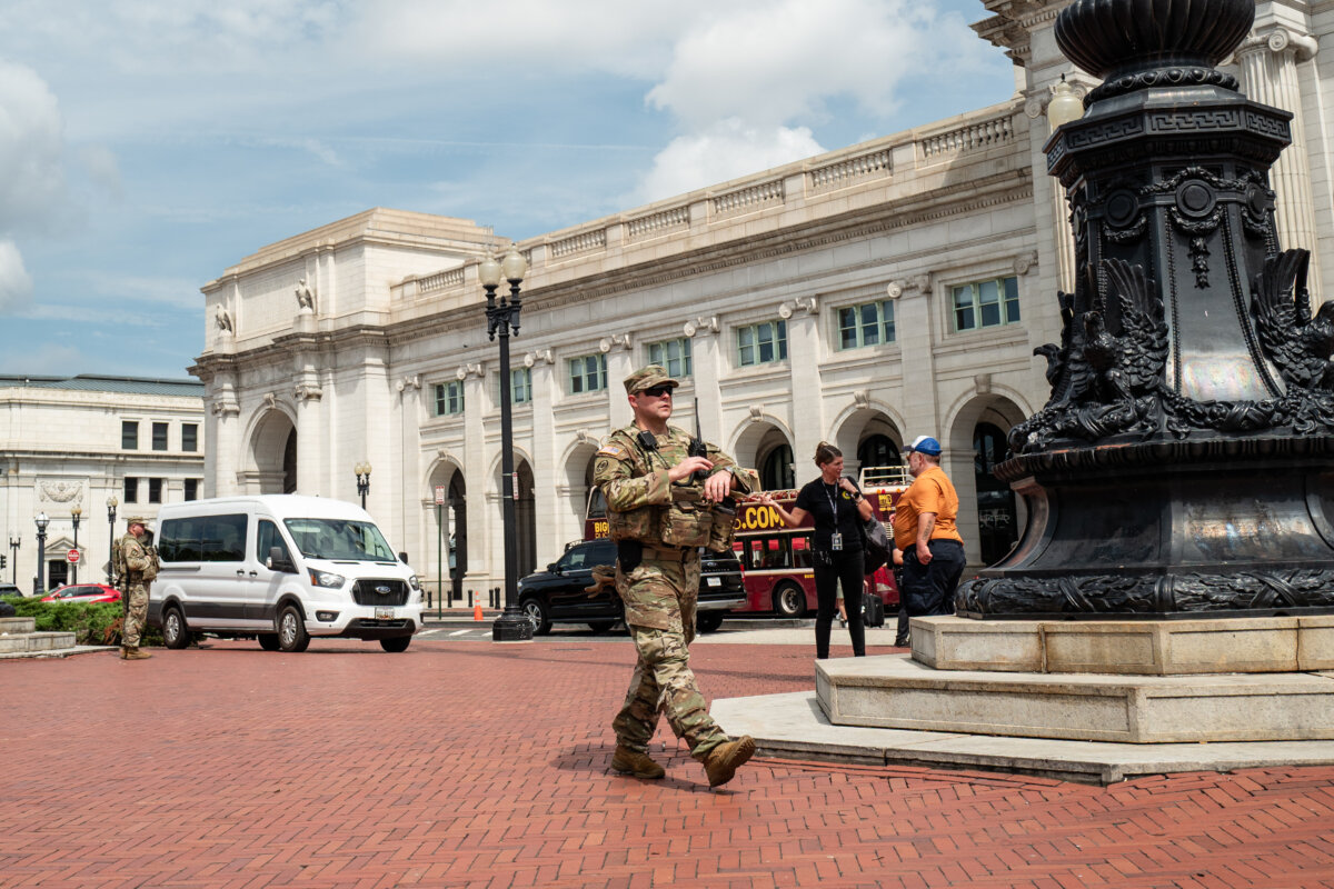 Members of the National Guard patrol at Union Station in Washington on Aug. 14, 2025. (Madalina Kilroy/The Epoch Times)
