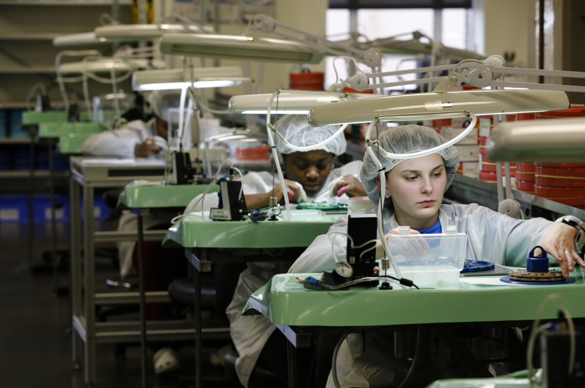 Khokeyma Reed assembles a watch at the Shinola watch factory in Detroit on Jan. 4, 2017.
(Jeff Kowalsky/AFP via Getty Images)