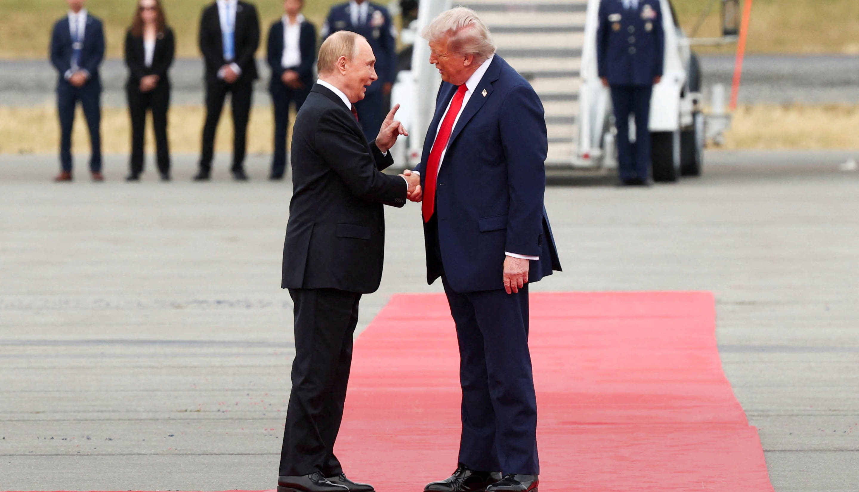 Day in Photos: Trump Meets Putin, World War II Anniversary, and Wildfire in Spain