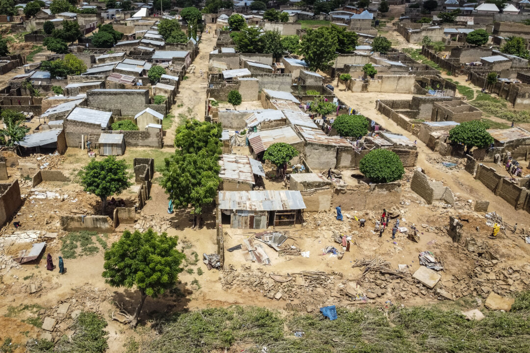 NextImg:Day in Photos: Flood in Nigeria, Air Canada Strike, and Anniversary of Victory in the Pacific