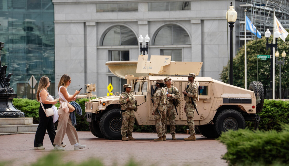 Members of the National Guard patrol at Union Station in Washington on Aug. 14, 2025. (Madalina Kilroy/The Epoch Times)