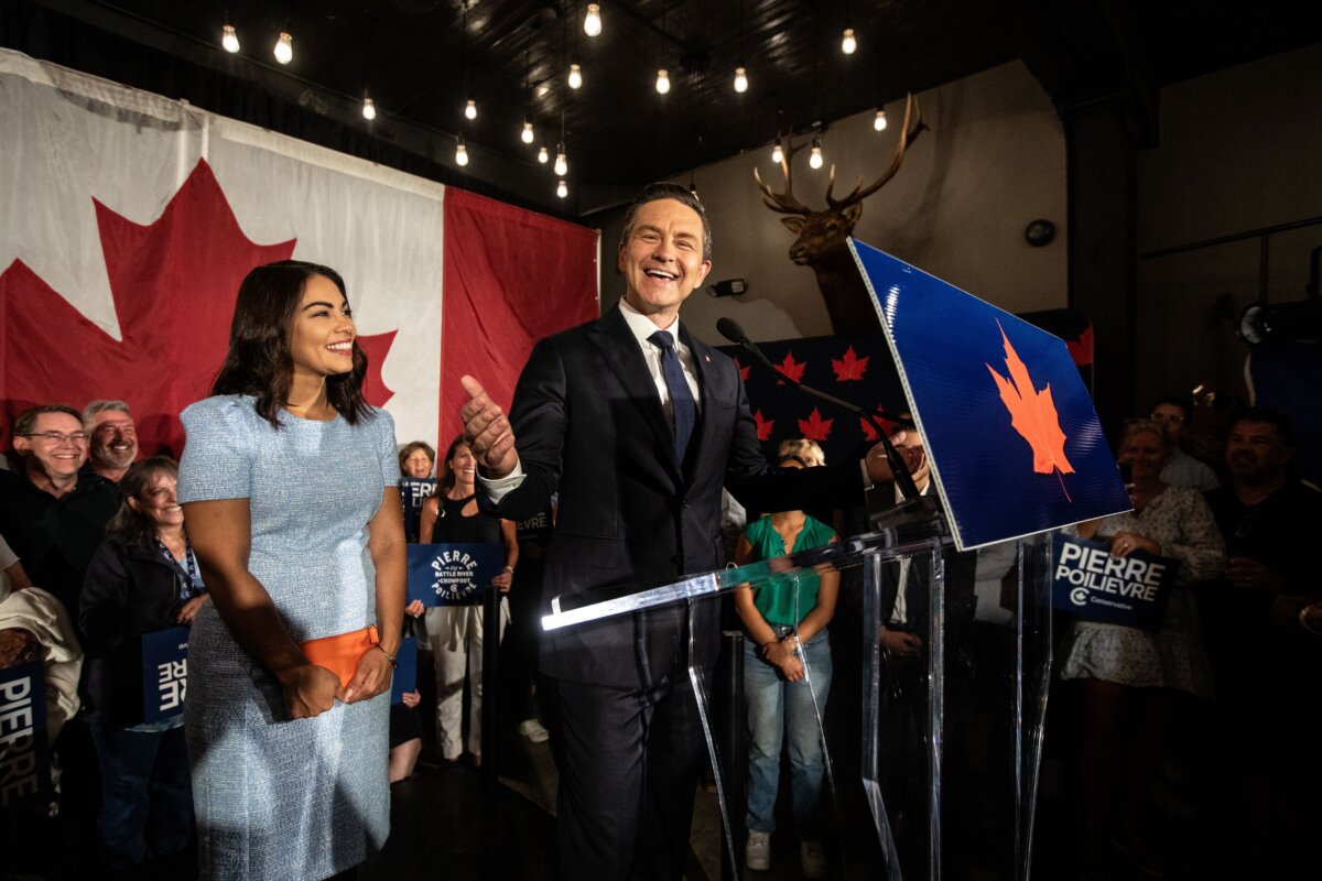Conservative Leader Pierre Poilievre and his wife, Anaida Poilievre, celebrate after winning the Battle River-Crowfoot byelection in Camrose, Alta., on Aug. 18, 2025. (The Canadian Press/Jason Franson)