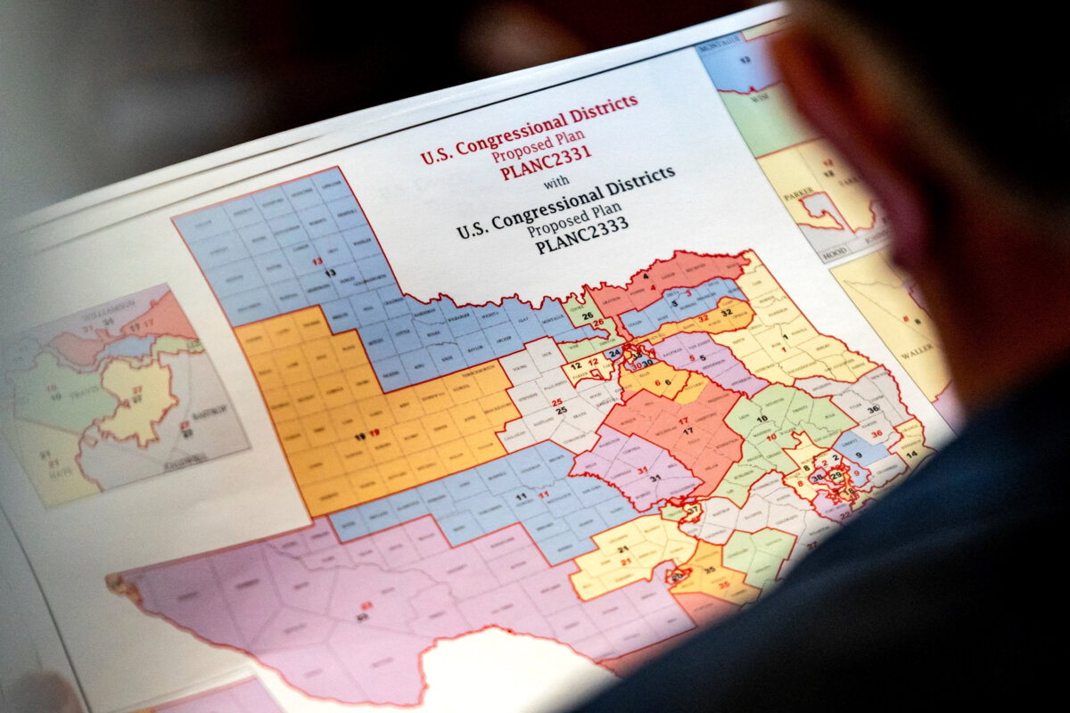 State Rep. Matt Morgan (R-Texas) holds a map of proposed new congressional districts in Texas during a legislative session at the Texas State Capitol in Austin on Aug. 20, 2025. (Sergio Flores/Reuters)