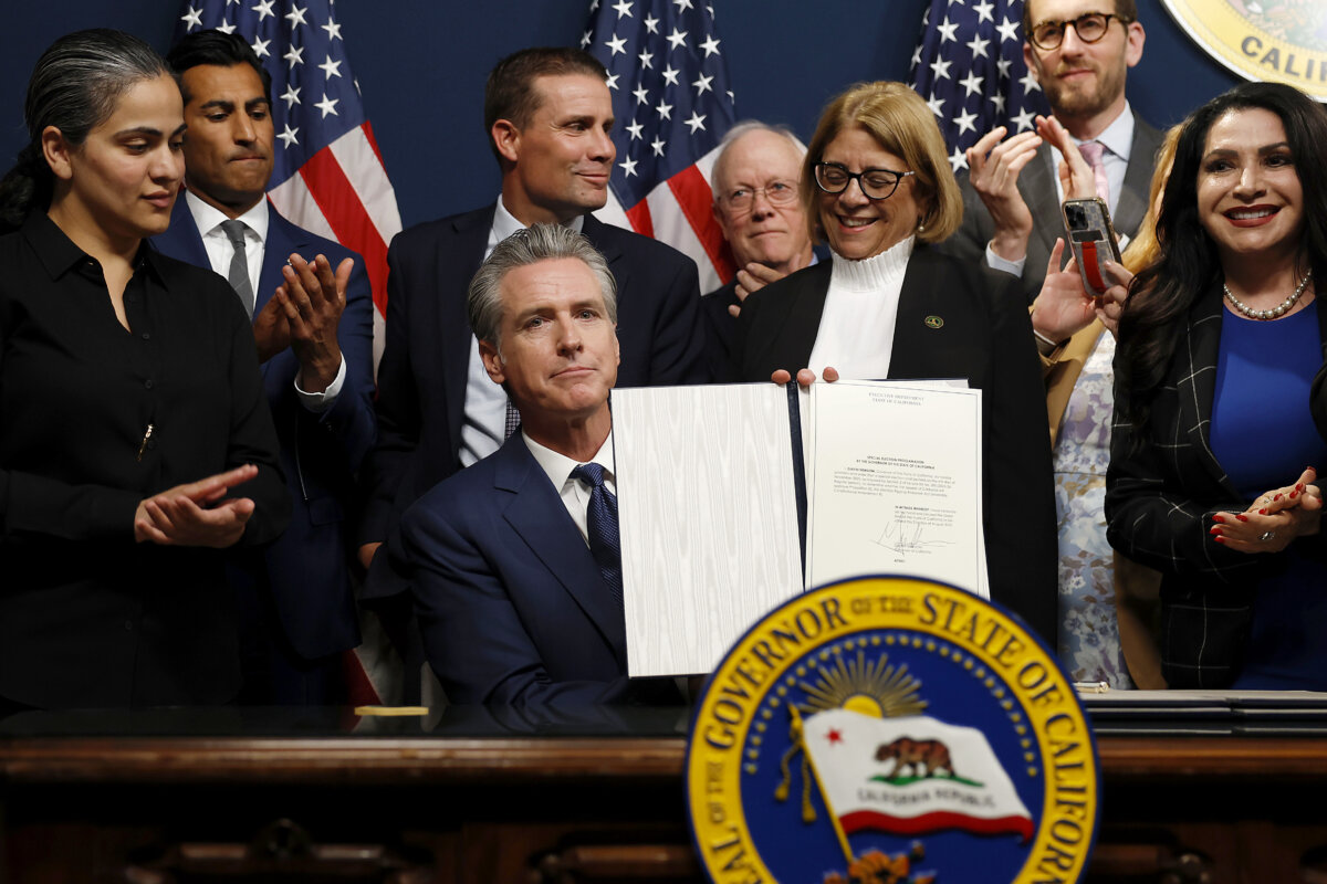SACRAMENTO, CALIFORNIA - AUGUST 21: California Gov. Gavin Newsom signs bills related to redrawing the state’s congressional maps on August 21, 2025 in Sacramento, California. In a move to counter Texas House Republicans’ plan to redraw the state’s congressional maps ahead of the 2026 midterm elections, California Democrats took up a proposed constitutional amendment to temporarily redraw their own congressional maps, potentially creating five additional U.S. House seats for their party. (Photo by Justin Sullivan/Getty Images)