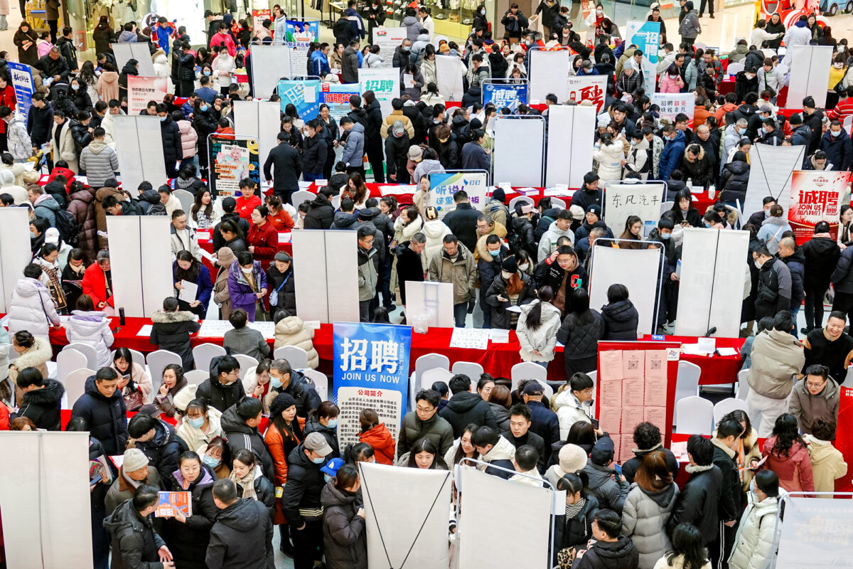 People attend a spring job fair in Yantai, Shandong Province, China, on Feb. 6, 2025. (China OUT/AFP via Getty Images)