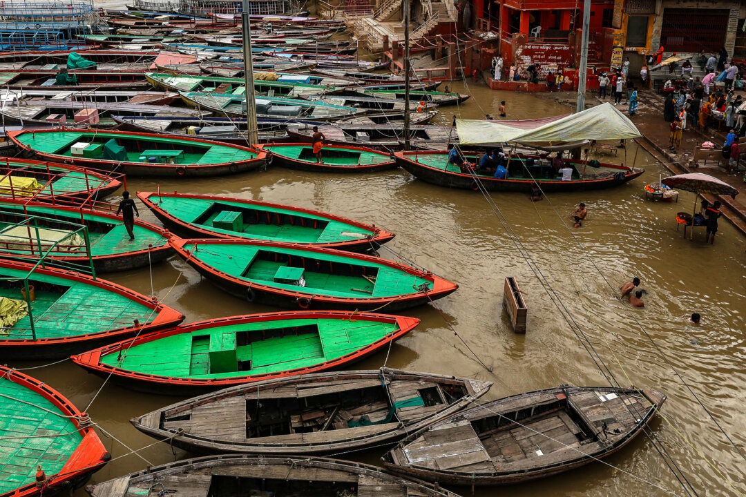 NextImg:Day in Photos: Floods in India, Anniversary of Mass Knife Attack, and Corgi Race