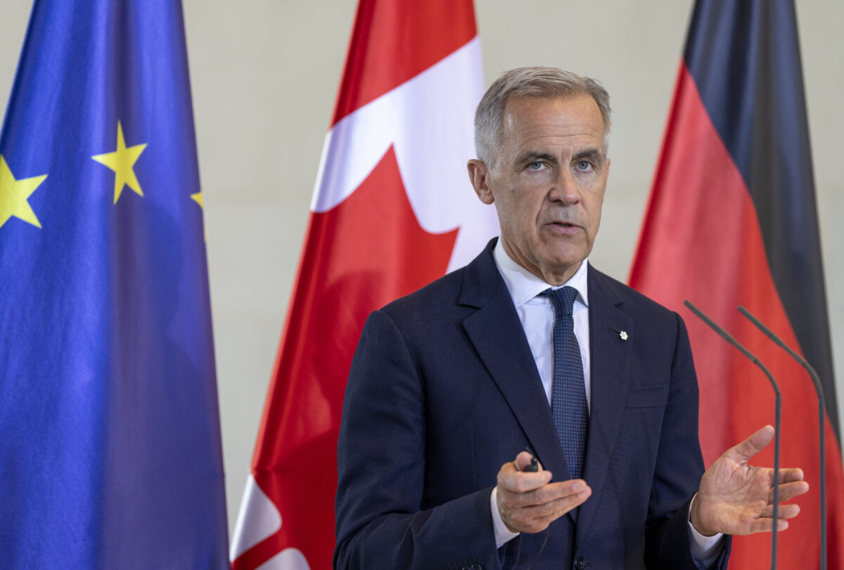 Prime Minister Mark Carney speaks during a joint media availability with German Chancellor Friedrich Merz (not shown) at the Federal Chancellery in Berlin, Germany on Aug. 26, 2025. (THE CANADIAN PRESS/Christinne Muschi)