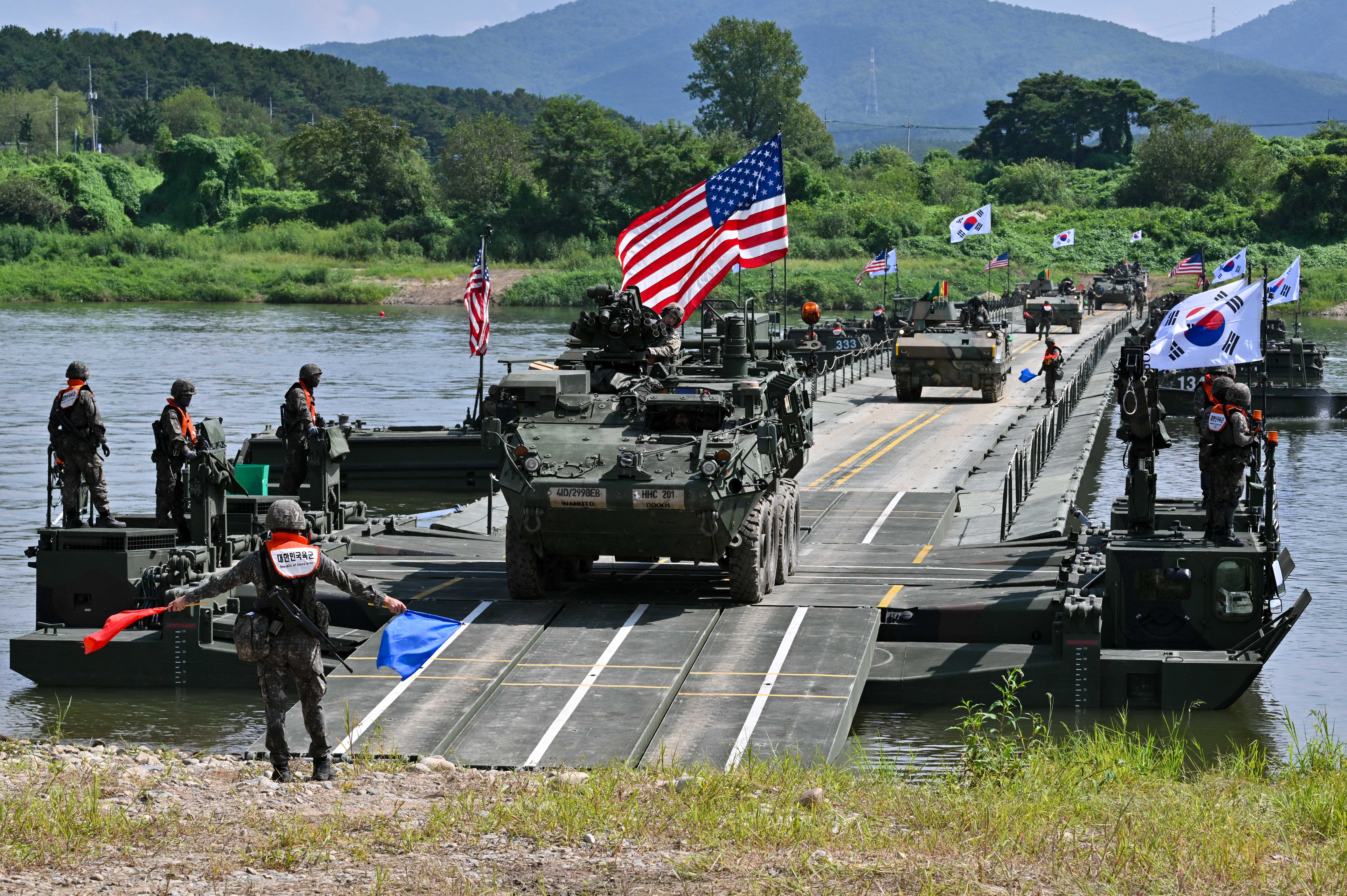 Day in Photos: US–South Korean Military Exercise, Church Shooting, Flood In India