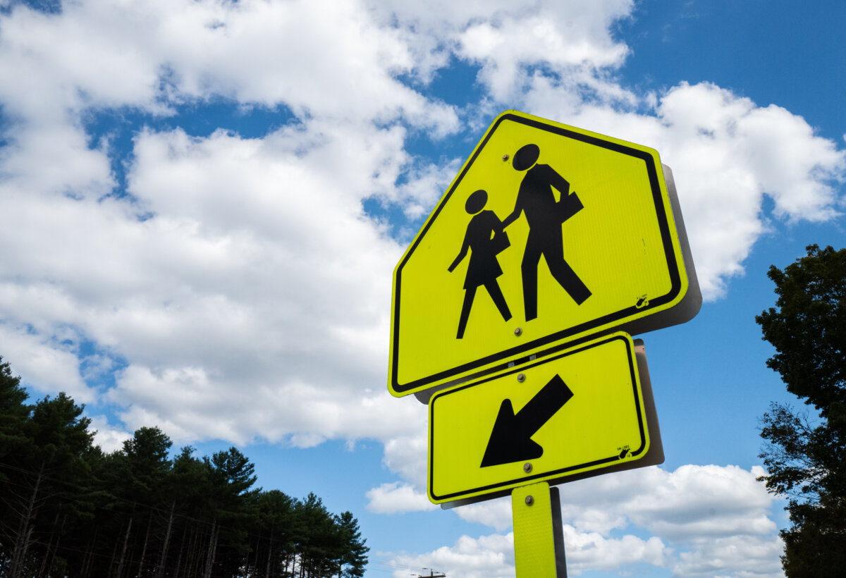 A school crosswalk sign in Petersburg, W.V., on Aug. 27, 2025. (John Fredricks/The Epoch Times)