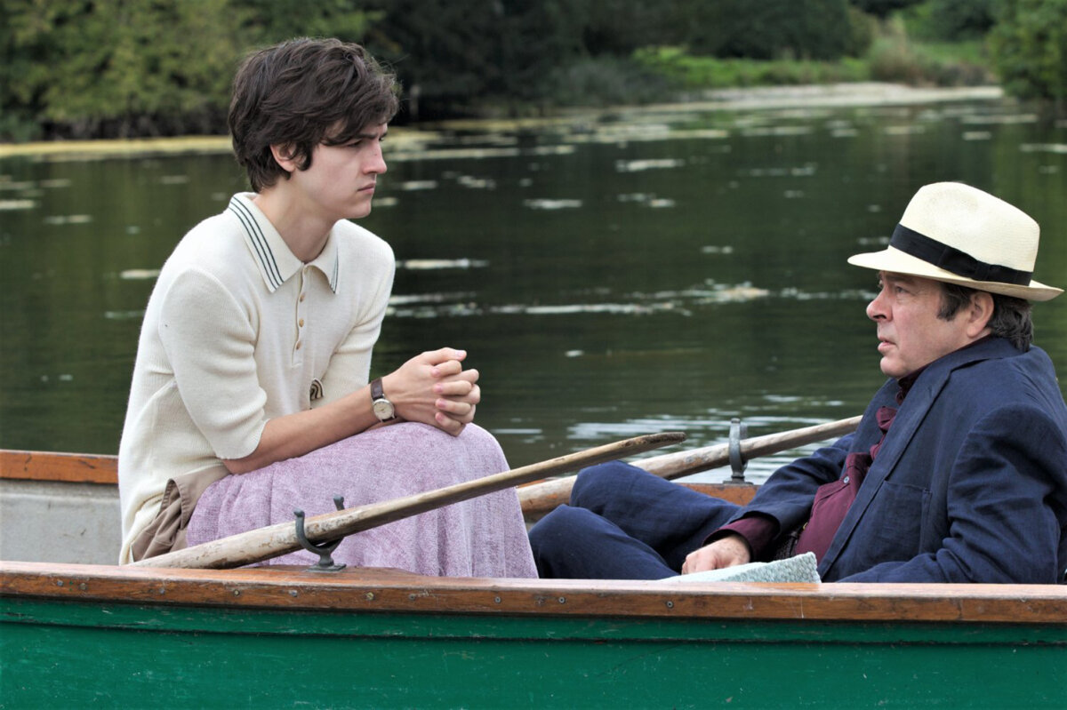 David Logan (Tommy Knight, L) and Ted Wallace (Roger Allam) talk about poetry, in “The Hippopotamus.” (Lightyear Entertainment)