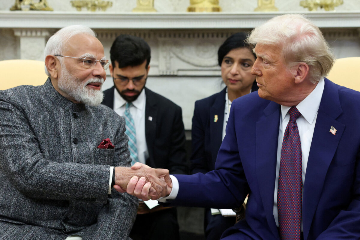 U.S. President Donald Trump (R) and Indian Prime Minister Narendra Modi (L) shake hands at the White House on Feb. 13, 2025. (Kevin Lamarque/Reuters)