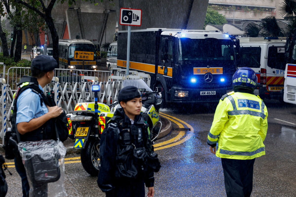 A prison van believed to be carrying Jimmy Lai arrives at the West Kowloon Magistrates' Courts building, where the founder of the now-defunct pro-democracy newspaper Apple Daily is set to take the witness stand for the first time in his national security collusion trial, in Hong Kong on Nov. 20, 2024. (Tyrone Siu/Reuters)
