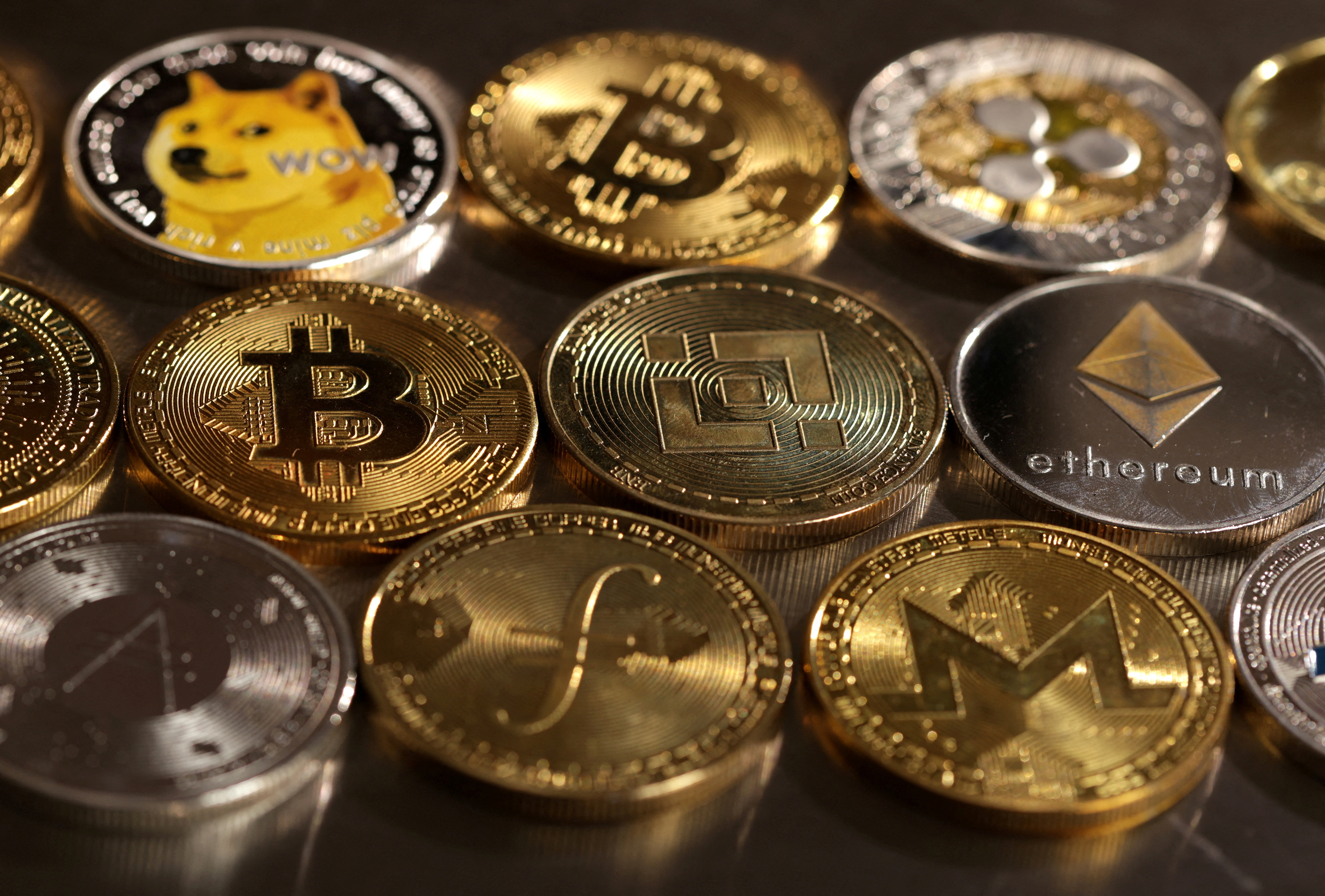 FILE PHOTO: Illustration shows representations of cryptocurrencies