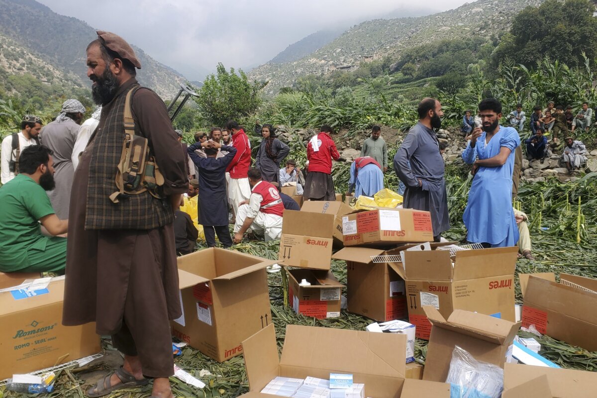 Civil defense workers, locals, and army soldiers prepare to evacuate injured victims of an earthquake that killed hundreds and destroyed numerous villages in eastern Afghanistan, in Mazar Dara, Kunar province, on Sept. 1, 2025. (Hedayat Shah/AP Photo)